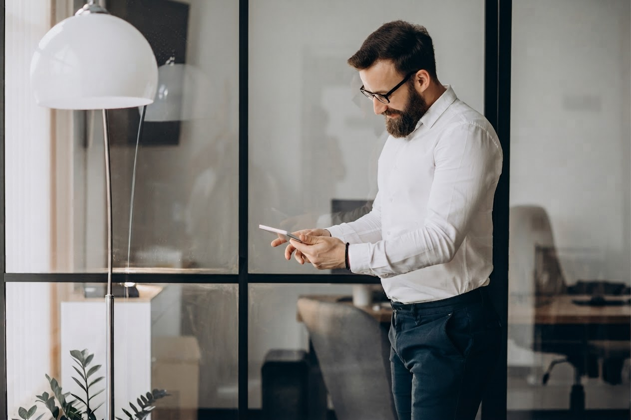 Professional using a tablet in a candid office setting, demonstrating Resolute's natural approach to people photography